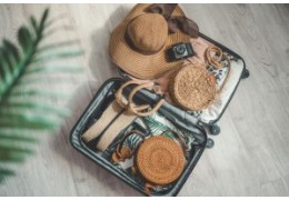 How do you pack a suitcase for a vacation to fit everything in and stay organized?
